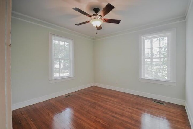 unfurnished room with ceiling fan, crown molding, and dark hardwood / wood-style flooring