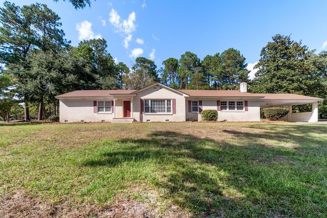 single story home featuring a carport and a front yard