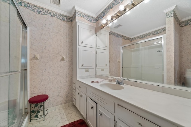 bathroom featuring vanity, a shower with shower door, ornamental molding, and toilet