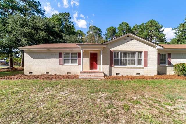 ranch-style home featuring a front lawn