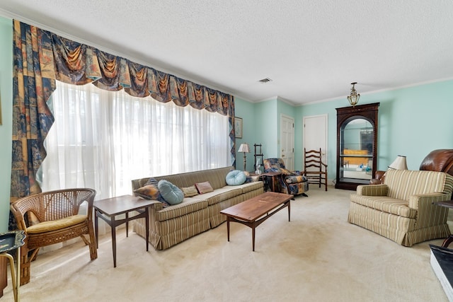 living room featuring ornamental molding, a textured ceiling, and light colored carpet