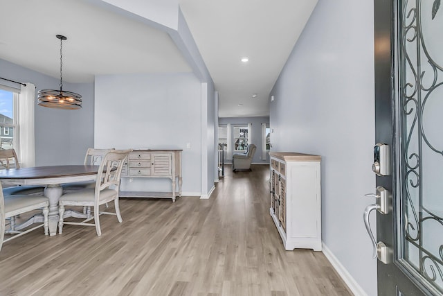 entryway with recessed lighting, baseboards, and light wood finished floors