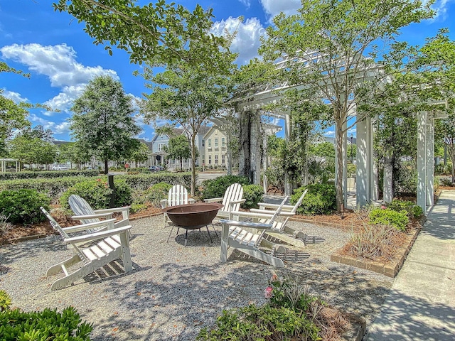 view of patio / terrace featuring an outdoor fire pit