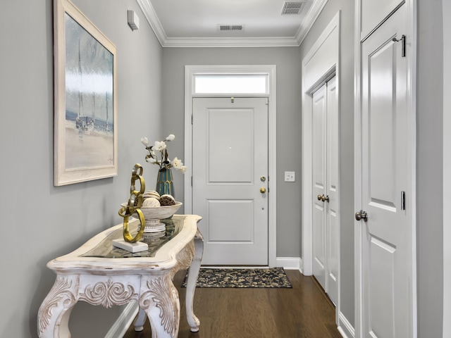 entryway with dark hardwood / wood-style flooring and crown molding