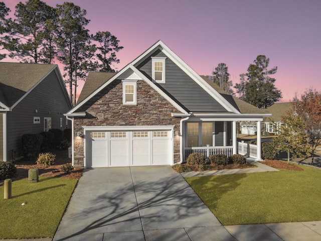 view of front of home with a yard and a porch