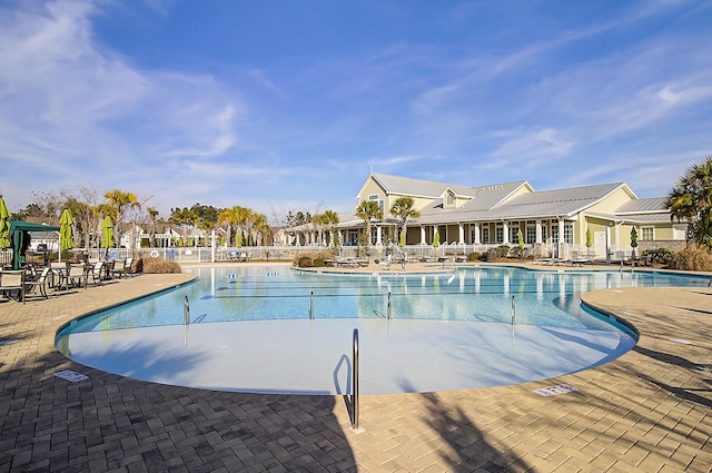 view of swimming pool with a patio