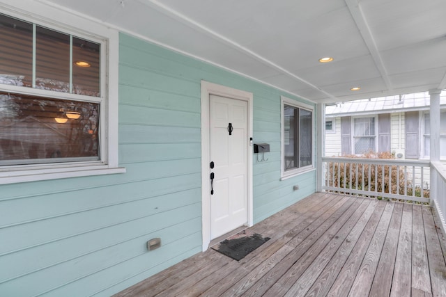 wooden terrace with a porch