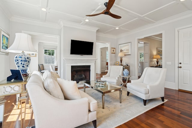 living room featuring crown molding, coffered ceiling, dark hardwood / wood-style flooring, and ceiling fan