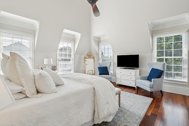 bedroom featuring dark hardwood / wood-style floors, multiple windows, and ceiling fan