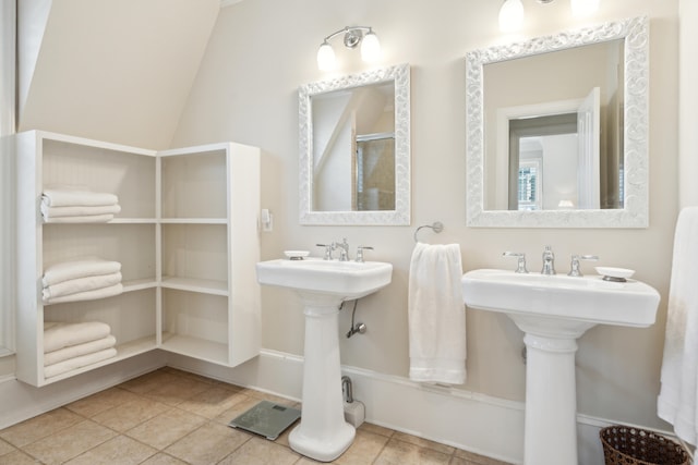 bathroom with tile patterned flooring and vaulted ceiling