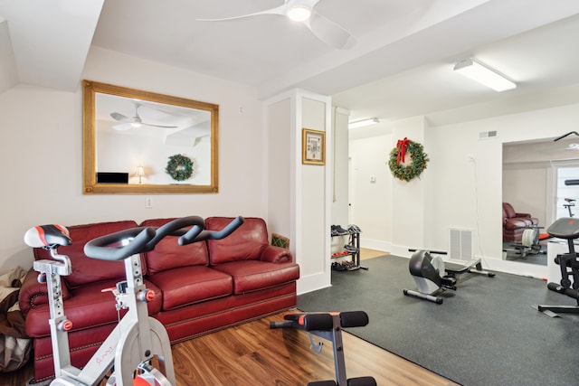 exercise area with hardwood / wood-style flooring and ceiling fan