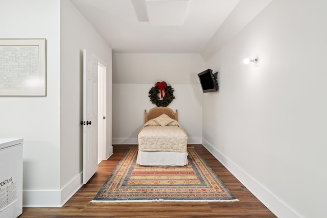 bedroom featuring dark wood-type flooring