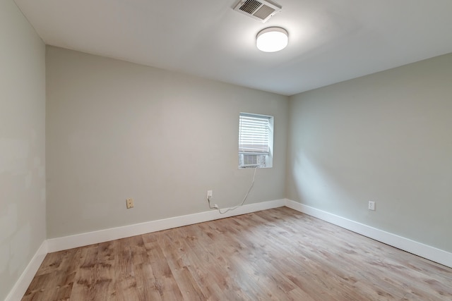 unfurnished room with light wood-type flooring