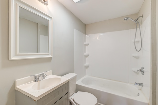 full bathroom featuring tub / shower combination, vanity, and toilet