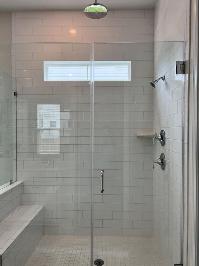 bathroom featuring a shower stall