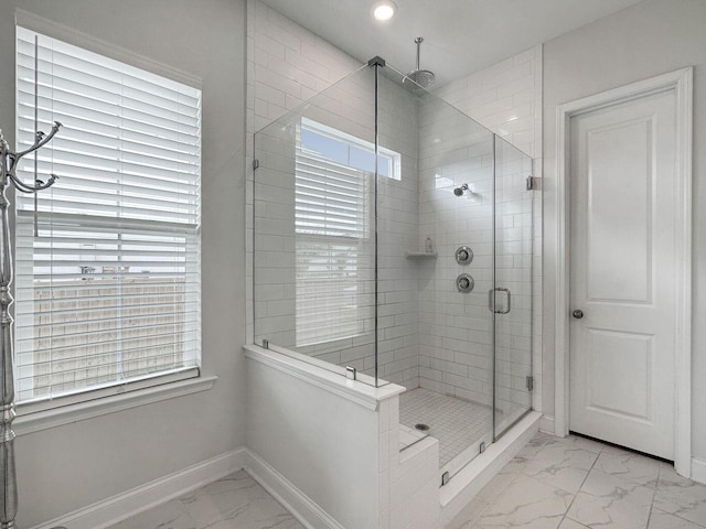 full bath with marble finish floor, recessed lighting, a shower stall, and baseboards