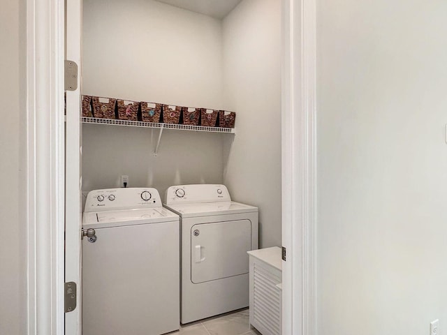 laundry room with laundry area and washing machine and clothes dryer