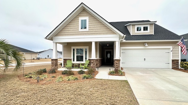 craftsman house featuring a garage and covered porch