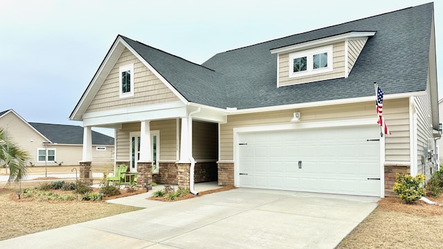 craftsman house featuring a garage and a porch