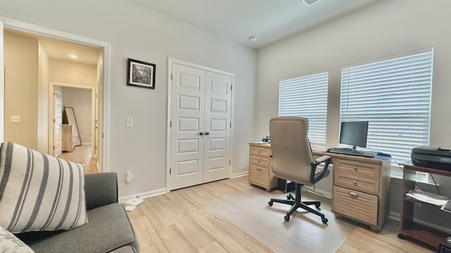 home office with light wood-type flooring