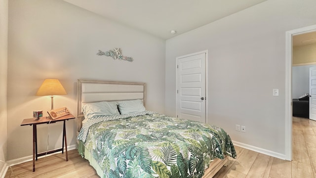 bedroom with light hardwood / wood-style floors