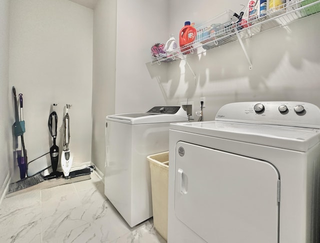 laundry room with washing machine and clothes dryer