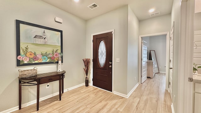 foyer with light hardwood / wood-style floors