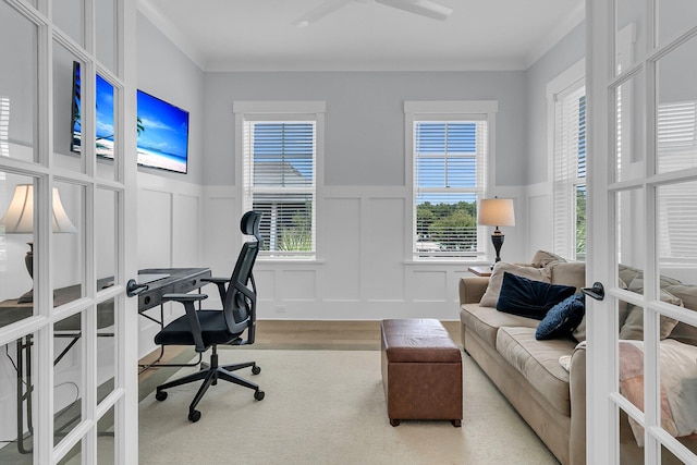 1182 Welcome Dr, Mount Pleasant, SC 29464 - office area with french doors, a decorative wall, wainscoting, wood finished floors, and ceiling fan