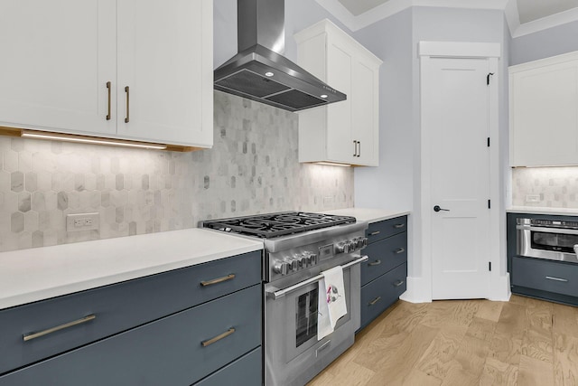 1182 Welcome Dr, Mount Pleasant, SC 29464 - kitchen with appliances with stainless steel finishes, wall chimney range hood, light countertops, and white cabinetry