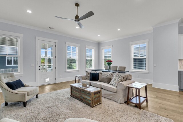 1182 Welcome Dr, Mount Pleasant, SC 29464 - living area with crown molding, light wood-style flooring, ceiling fan, baseboards, and recessed lighting