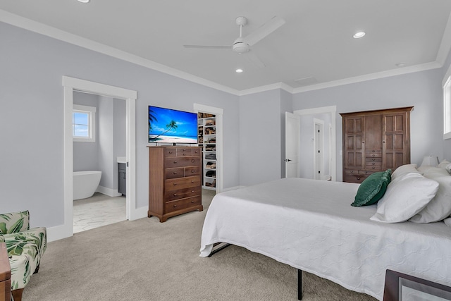 1182 Welcome Dr, Mount Pleasant, SC 29464 - bedroom featuring a walk in closet, recessed lighting, ornamental molding, a closet, and ensuite bath