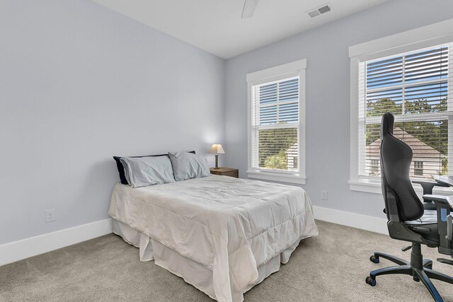 1182 Welcome Dr, Mount Pleasant, SC 29464 - bedroom featuring light carpet, baseboards, and an office area