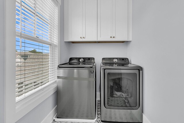 1182 Welcome Dr, Mount Pleasant, SC 29464 - laundry room featuring cabinet space, washing machine and clothes dryer, and baseboards