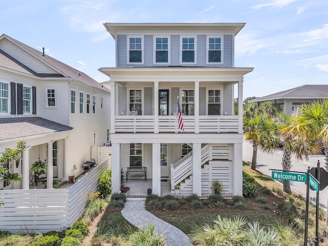 1182 Welcome Dr, Mount Pleasant, SC 29464 - coastal inspired home featuring a porch, stairs, and a balcony