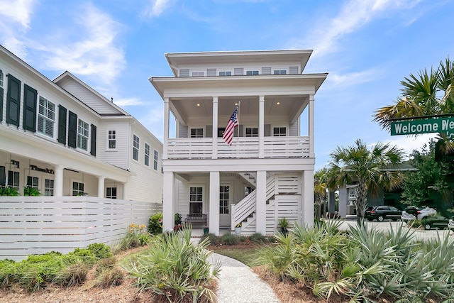 1182 Welcome Dr, Mount Pleasant, SC 29464 - coastal home with stairway, covered porch, and a balcony