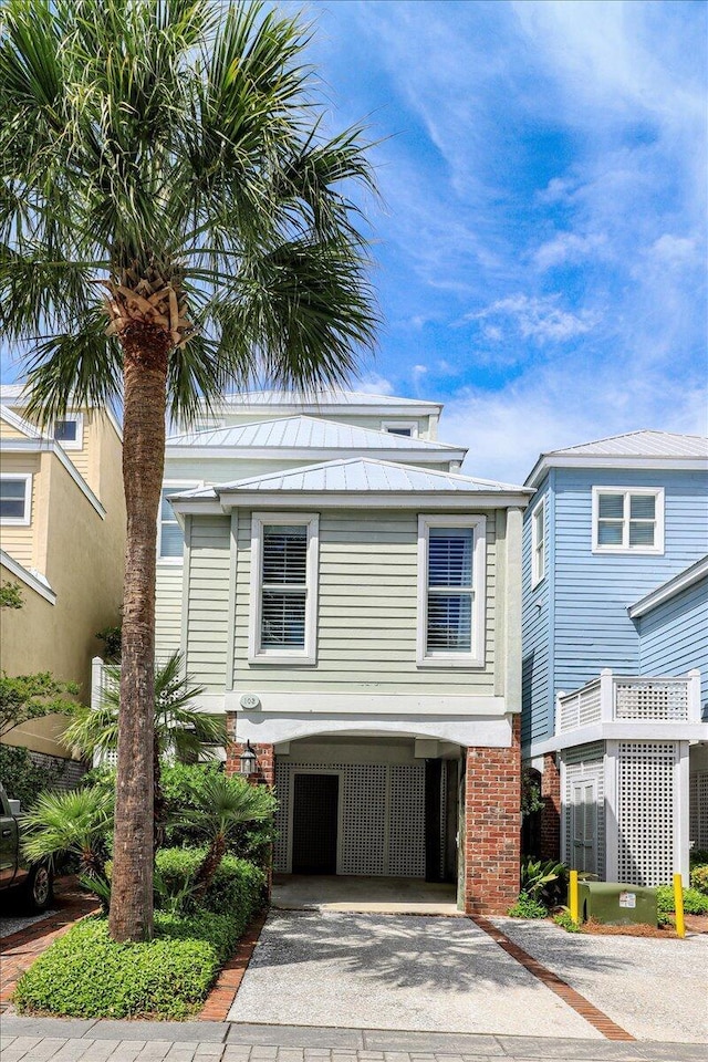 103 Grand Pavilion Blvd, Isle Of Palms, SC 29451 - coastal inspired home with a carport and driveway