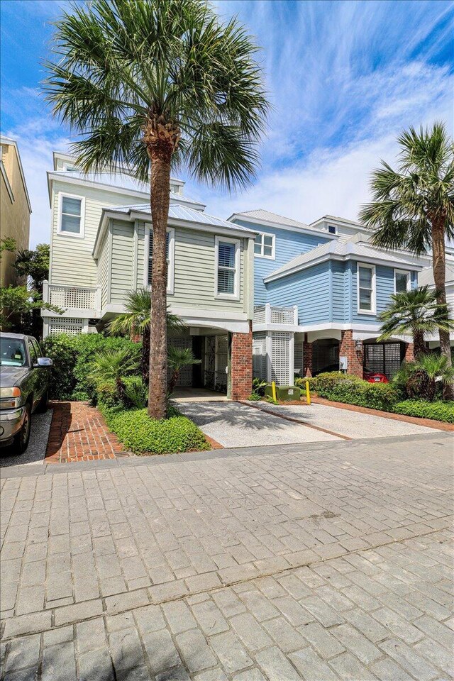 103 Grand Pavilion Blvd, Isle Of Palms, SC 29451 - view of front facade with a carport and decorative driveway
