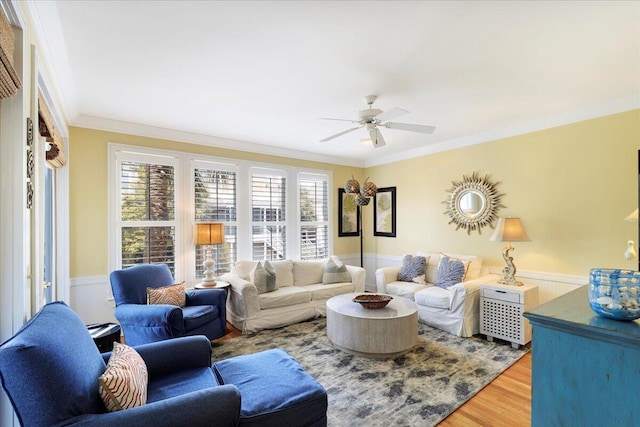 103 Grand Pavilion Blvd, Isle Of Palms, SC 29451 - living area featuring wainscoting, ornamental molding, a ceiling fan, and wood finished floors