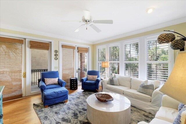 103 Grand Pavilion Blvd, Isle Of Palms, SC 29451 - living area featuring crown molding, a wealth of natural light, a ceiling fan, and wood finished floors