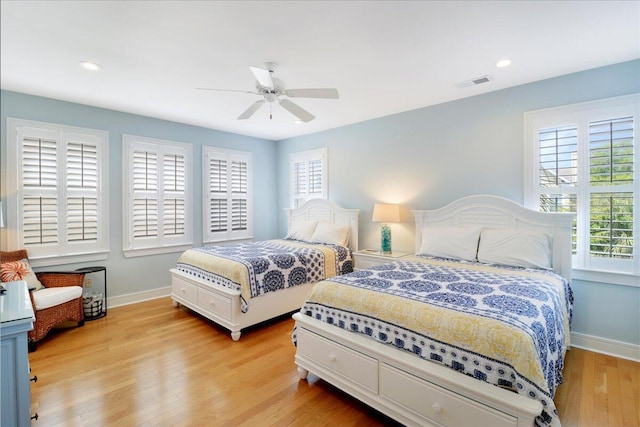 103 Grand Pavilion Blvd, Isle Of Palms, SC 29451 - bedroom with light wood-style floors, visible vents, baseboards, and ceiling fan