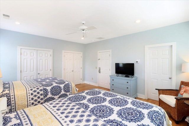 103 Grand Pavilion Blvd, Isle Of Palms, SC 29451 - bedroom featuring light wood-style floors, multiple closets, baseboards, and visible vents