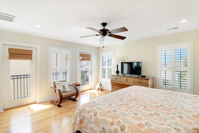 103 Grand Pavilion Blvd, Isle Of Palms, SC 29451 - bedroom with access to outside, multiple windows, visible vents, and light wood-style floors