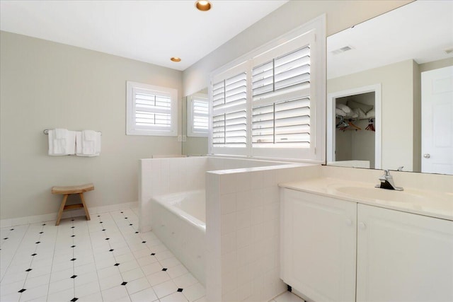103 Grand Pavilion Blvd, Isle Of Palms, SC 29451 - full bathroom featuring baseboards, visible vents, a garden tub, and vanity