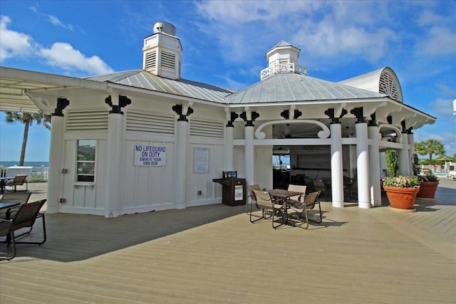 103 Grand Pavilion Blvd, Isle Of Palms, SC 29451 - wooden terrace with a gazebo, outdoor dining space, and ceiling fan