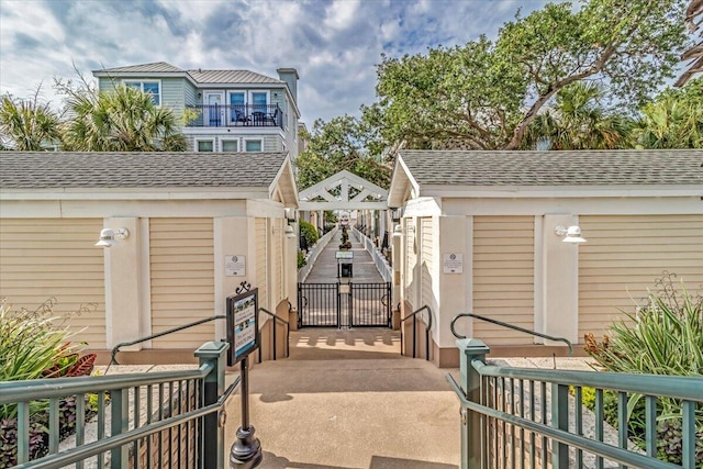 103 Grand Pavilion Blvd, Isle Of Palms, SC 29451 - exterior space with a gate and a shingled roof