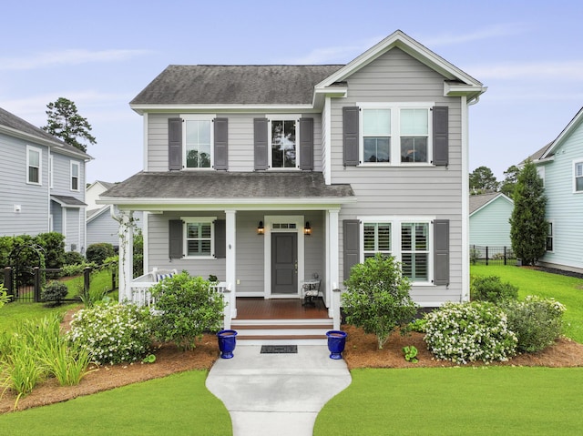 3998 Capensis Ln, Ravenel, SC 29470 - view of front facade with covered porch and roof with shingles