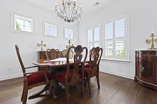 3998 Capensis Ln, Ravenel, SC 29470 - dining area featuring a chandelier, plenty of natural light, ornamental molding, and dark wood-style flooring
