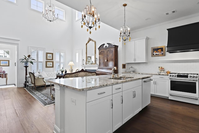 3998 Capensis Ln, Ravenel, SC 29470 - kitchen featuring white gas stove, a sink, a chandelier, ventilation hood, and a high ceiling
