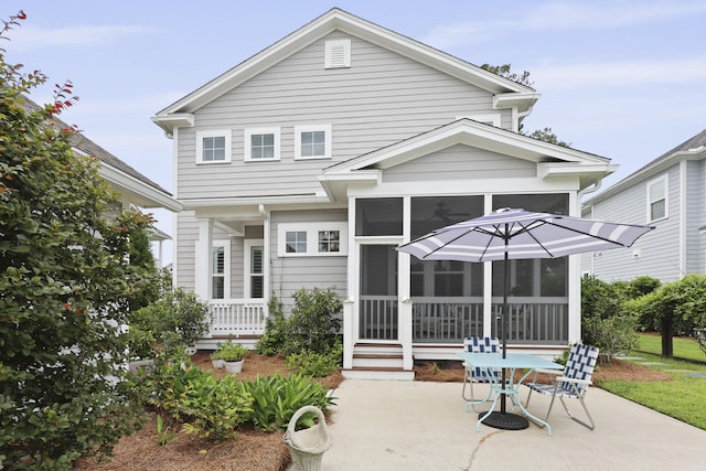 3998 Capensis Ln, Ravenel, SC 29470 - back of house with a sunroom and a patio