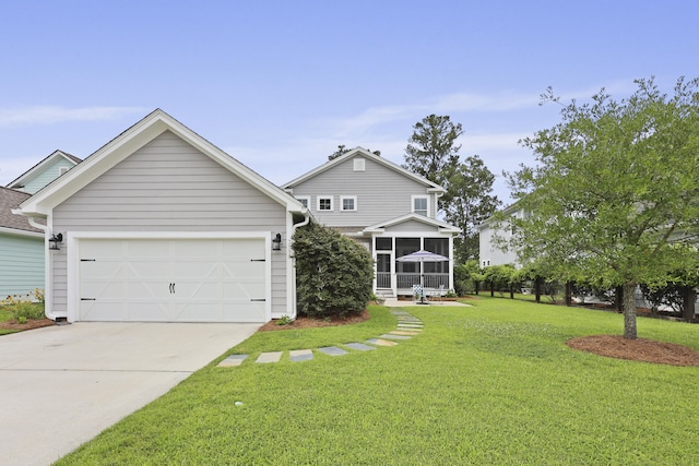 3998 Capensis Ln, Ravenel, SC 29470 - view of front facade with a front yard, concrete driveway, an attached garage, and a sunroom